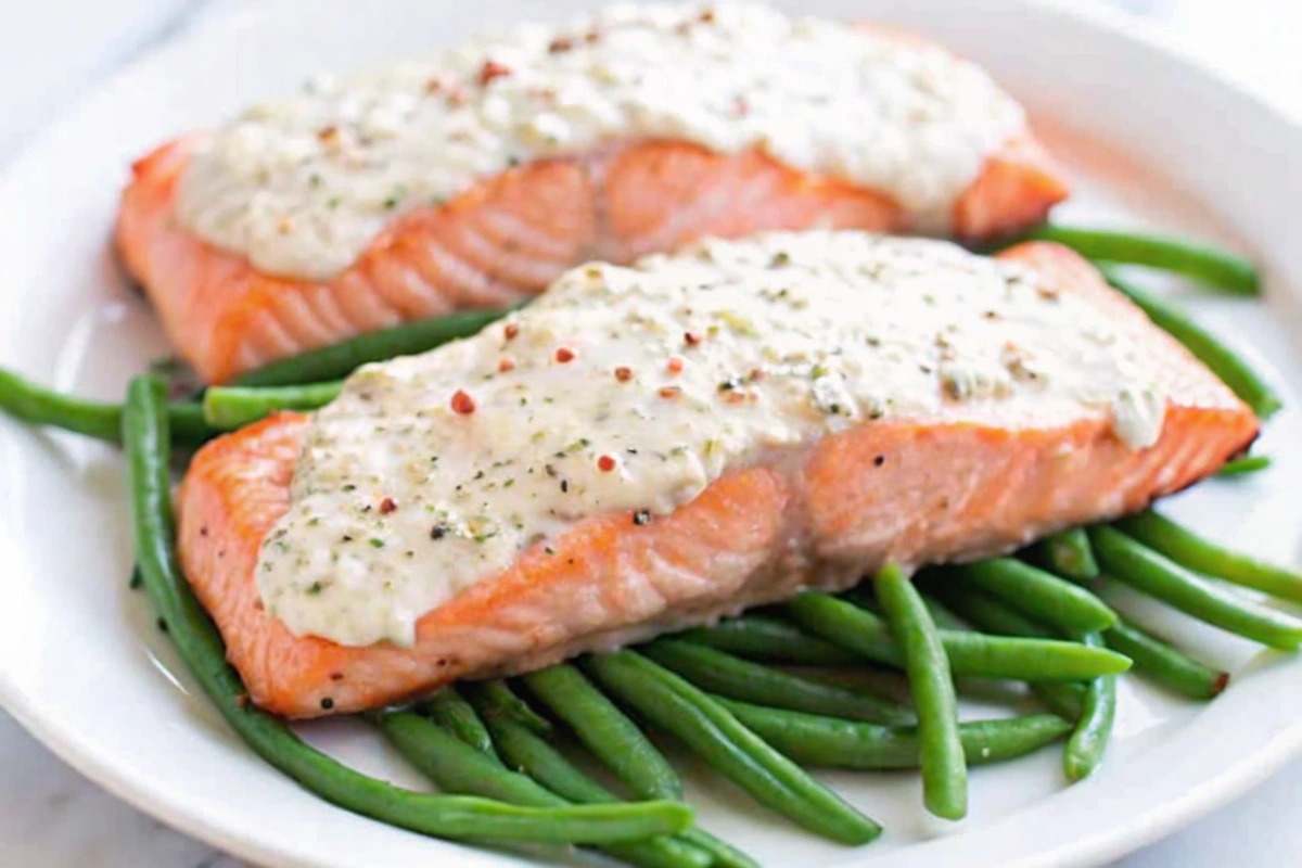 Close-up of Easy Sour Cream Baked Salmon with herb garnish