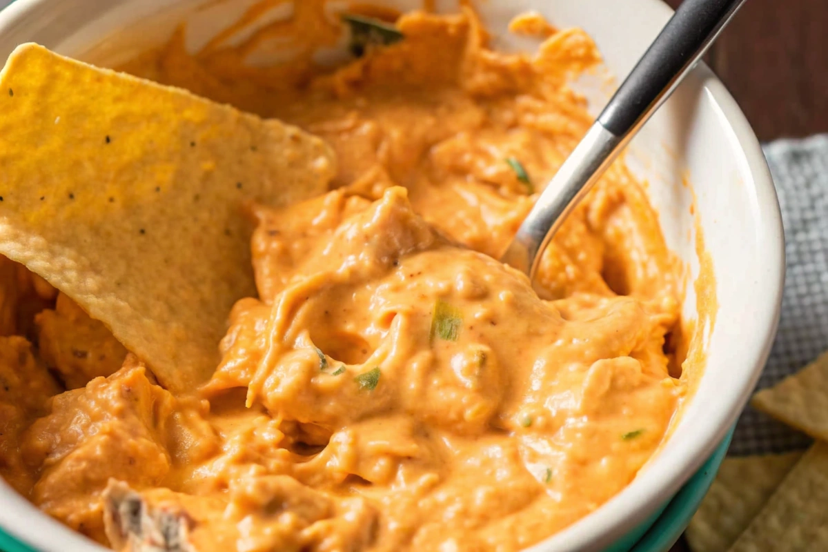 Vegan Buffalo Chicken Dip served in a cast-iron skillet with tortilla chips